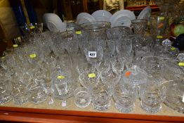 A GROUP OF GLASSWARE, including drinking glasses, bowls, bowls and covers, jugs and vases, a small