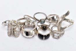 ELEVEN RINGS, to include an openwork butterfly wing ring, together with gem and paste examples,