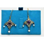 A PAIR OF GEM DROP EARRINGS, the central circular amethyst within a shaped surround set with four