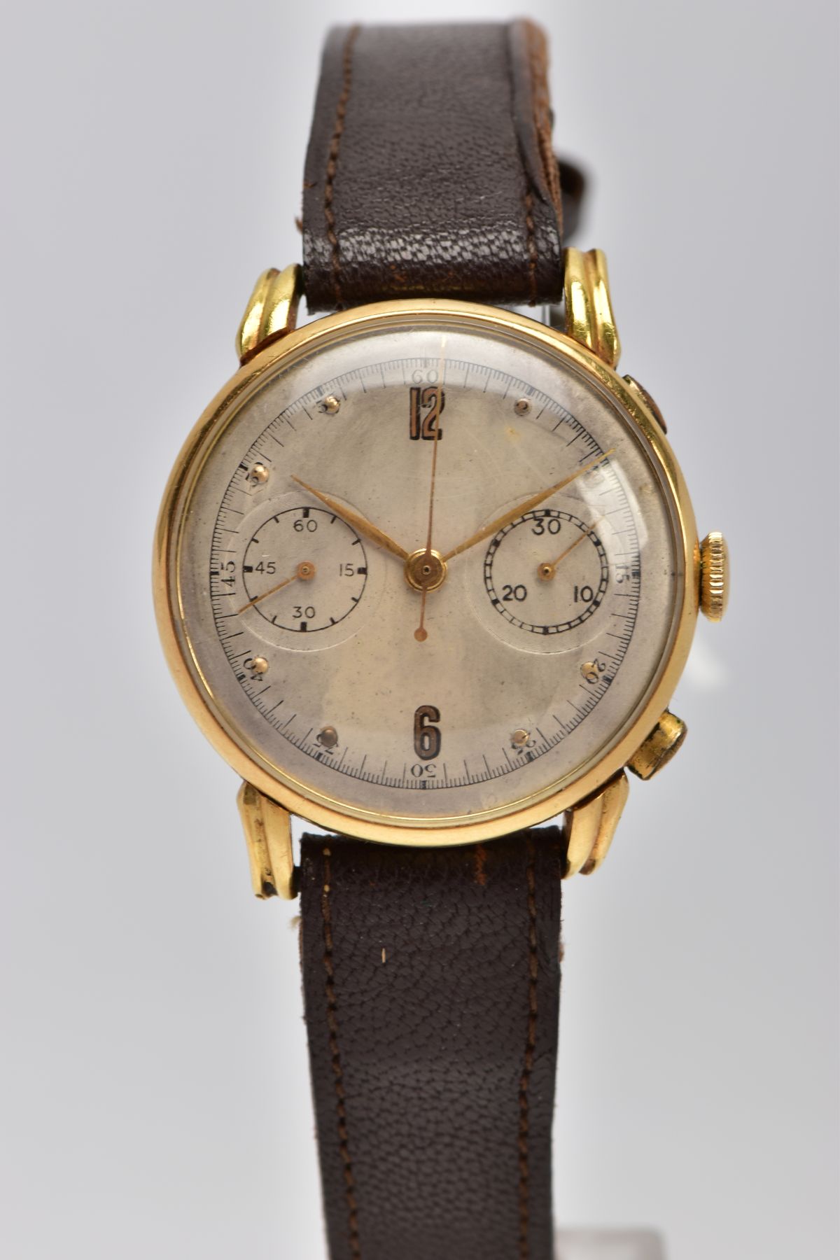 A MINERVA 18CT GOLD TWIN DIAL CHRONOGRAPH WRISTWATCH, discoloured silver dial with gold coloured