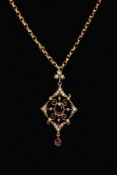 AN EARLY 20TH CENTURY GARNET AND SPLIT PEARL PENDANT NECKLACE, the openwork drop pendant, set with a