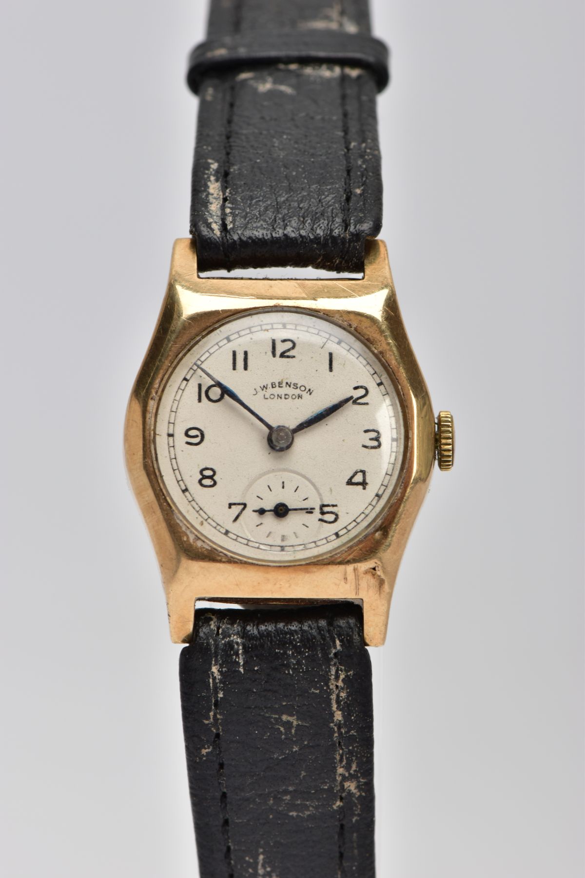 A 9CT GOLD CASED, HAND WOUND J.W. BENSON WRISTWATCH, round silvered dial, Arabic numerals,
