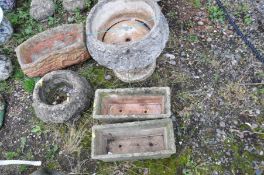 A COMPOSITE GARDEN URN with foliate detail to bowl and base 45cm high, a fallen log effect