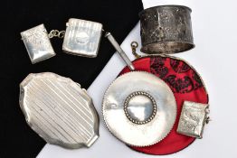 SEVEN SILVER AND WHITE METAL ACCESSORIES, to include three early 20th century silver vesta cases,