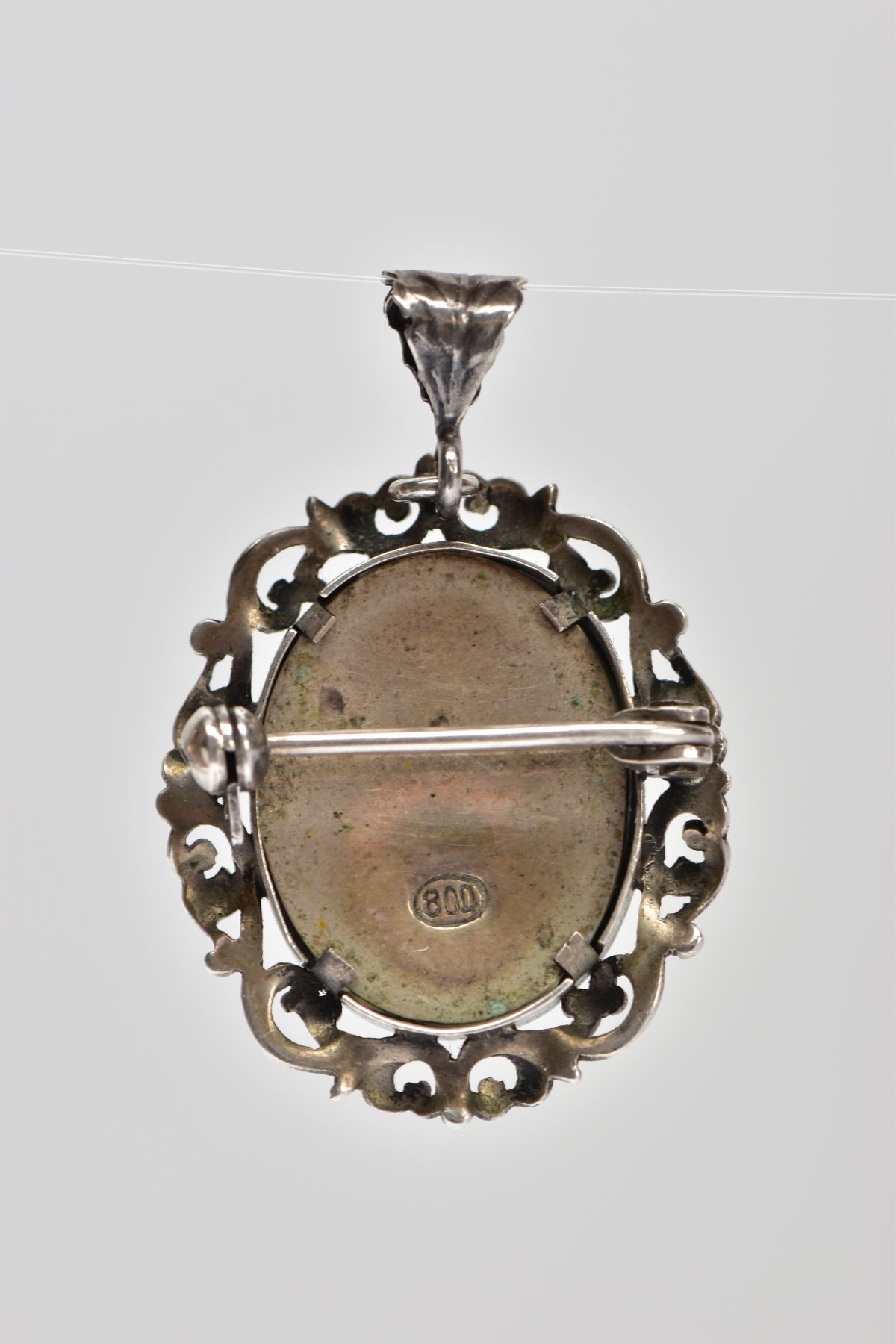 A PENDANT/BROOCH, of oval outline with central hand painted portrait of a lady within a scrolling - Image 2 of 2