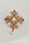 A 9CT GOLD RUBY AND CULTURED PEARL FANCY BROOCH PENDANT, measuring approximately 35mm in diameter,