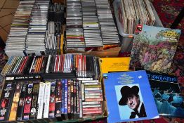 FOUR TRAYS CONTAINNG CD'S, LP'S, CASSETTE TAPES, DVD'S AND VIDEO'S mostly classical music and films