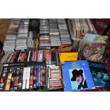 FOUR TRAYS CONTAINNG CD'S, LP'S, CASSETTE TAPES, DVD'S AND VIDEO'S mostly classical music and films