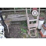 A GARDEN TABLE in need of restoration with a slatted wood top and cast iron ends width 123cm depth