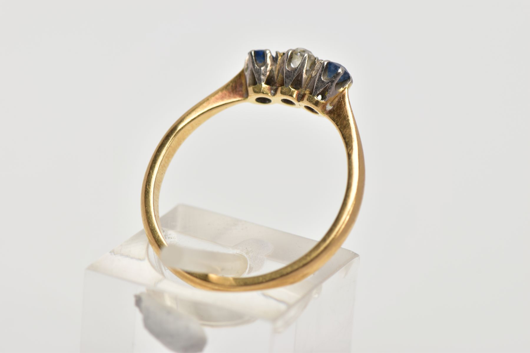 A YELLOW METAL THREE STONE RING, designed with a central, claw set old cut diamond, flanked with - Image 3 of 4