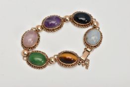 A 9CT GOLD SEMI-PRECIOUS STONE BRACELET, designed with six semi-precious stone cabochons, such as