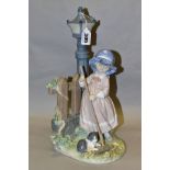 A LLADRO FIGURE GROUP FALL CLEAN UP, model no 5286, depicting a girl raking up leaves, designed by