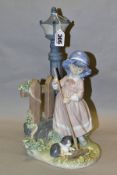 A LLADRO FIGURE GROUP FALL CLEAN UP, model no 5286, depicting a girl raking up leaves, designed by