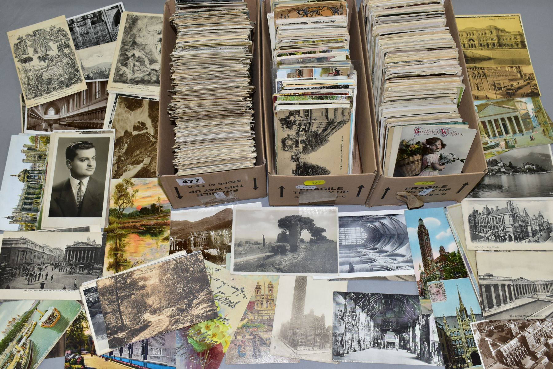 POSTCARDS, approximately 1400-1500 postcards in three small boxes containing predominantly early