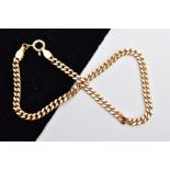 A 9CT GOLD CURB LINK BRACELET, fitted with a spring clasp hallmarked 9ct gold London import,