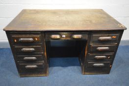 AN EARLY 20TH CENTURY OAK PEDESTAL DESK, with nine assorted drawers, labelled 'the Crusader Office