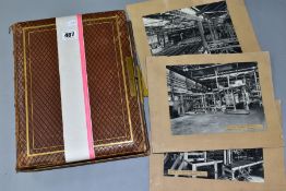 PHOTOGRAPH ALBUM, a leather bound, brass clasped photograph album, containing approximately