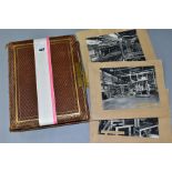 PHOTOGRAPH ALBUM, a leather bound, brass clasped photograph album, containing approximately