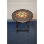 AN EARLY 20TH CENTURY OAK CIRCULAR OCCASSIONAL TABLE, with a circular cloisonne insert, carving to