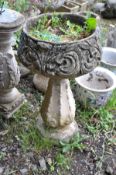 A COMPOSITE GARDEN URN with foliate detail to bowl 88cm high