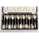 A CASED COMPLETE SET OF TWELVE FRUIT SPOONS, with a tapered treaded point to the handle, engraved '