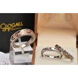 THREE SILVER CLOGAU RINGS, the first a tapered silver band with applied 'Dragon Wing' rose gold