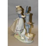 A LLADRO FIGURE GROUP SUMMER ON THE FARM, model no 5285, depicting a girl and birds at a water pump,