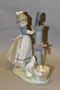 A LLADRO FIGURE GROUP SUMMER ON THE FARM, model no 5285, depicting a girl and birds at a water pump,