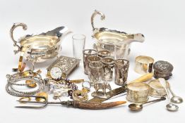 A BOX OF SILVER AND OTHER METALWARE, to include three hallmarked napkin rings, a silver cap for a