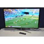 A SAMSUNG UE40ES6540 40in LCD TV with remote and stand