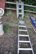 AN ALUMINIUM STEP LADDER 190cm high and a four section collapsible ladder 90cm each section (