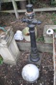 A CAST ALUMINIUM LOW LAMP POST BASE 110cm high and a plastic sphere with metal banding (2)