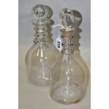 TWO GEORGE III CLEAR GLASS MALLET SHAPED DECANTERS, with target stoppers and triple ring necks,