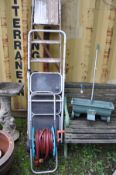A SET OF WOODEN STEP LADDERS 197cm high, a set of metal steps, a lawn seeder and a hose reel (4)