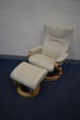 A HIMOLLA CREAM LEATHER RECLINING SWIVEL CHAIR on a circular beech base together with a matching