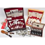 TWO CASED SETS OF PLATED CUTLERY, A CASED SPOON SET, LOOSE SPOONS, A CARVING SET AND SALAD UTENSILS,