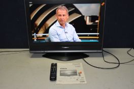 A PANASONIC TX 26LMD70 26in TV with remote and manual