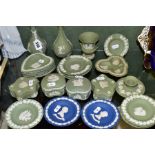 A GROUP OF WEDGWOOD JASPERWARES, mostly green, comprising two green bud vases, an urn shaped vase,