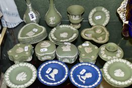 A GROUP OF WEDGWOOD JASPERWARES, mostly green, comprising two green bud vases, an urn shaped vase,