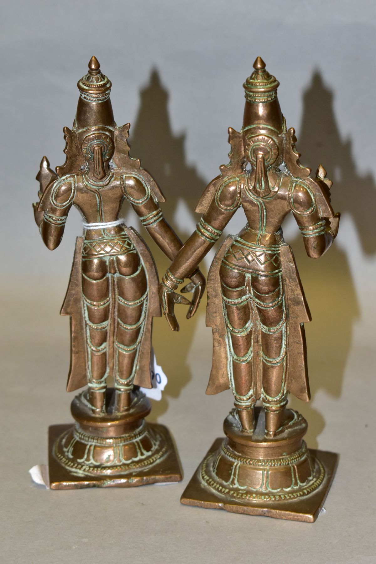 A NEAR PAIR OF BRONZE FIGURES OF PARVATI HOLDING A LOTUS FLOWER, cast on a circular plinth with - Image 3 of 7