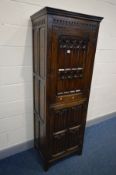 A GOOD QUALITY REPRODUCTION OAK TWO DOOR CUPBOARD, ecclesiastical and linenfold panelled doors