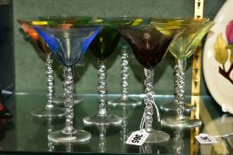 A SET OF EIGHT HARLEQUIN COCKTAIL GLASSES, with clear glass barley twist stems, height 15cm (