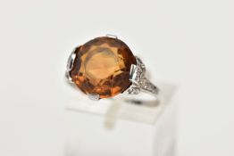 A LATE VICTORIAN CITRINE AND DIAMOND RING, a round faceted citrine measuring approximately 12.3mm in