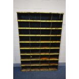 AN INDUSTRIAL SHELVING UNIT made up of thirty six pigeon holes (Sd and rusted)