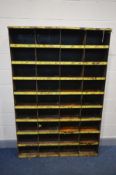 AN INDUSTRIAL SHELVING UNIT made up of thirty six pigeon holes (Sd and rusted)
