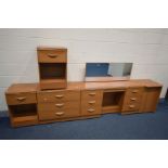 AN ALSTONS FIVE PIECE BEDROOM SUITE, comprising a dressing table, pair of bedside cabinets, chest of