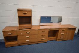 AN ALSTONS FIVE PIECE BEDROOM SUITE, comprising a dressing table, pair of bedside cabinets, chest of