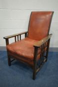 AN ARTS AND CRAFTS BEECH RECLINING ARMCHAIR, covered with brown leather upholstery and matching seat