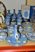 A GROUP OF WEDGWOOD PALE BLUE JASPERWARE, including bud vases, small Campania vases, two cigarette