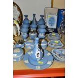 A GROUP OF WEDGWOOD PALE BLUE JASPERWARE, including bud vases, small Campania vases, two cigarette